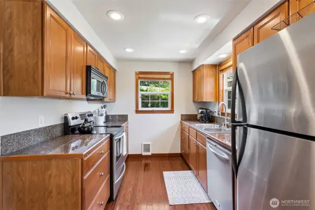 All appliances are included with this beautiful granite tile kitchen.