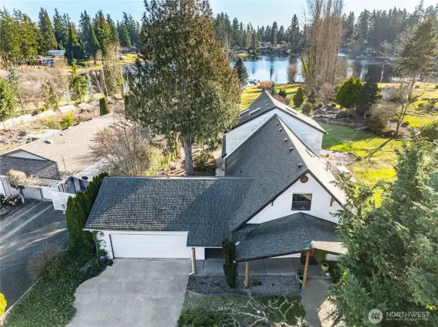 2-Car Garage with rafter storage / Cat door   Sheltered, covered and gated breezeway between house and garage  Parking for 4 cars in driveway, with additional parking for 3+ more cars on front gravel pad  RV parking
