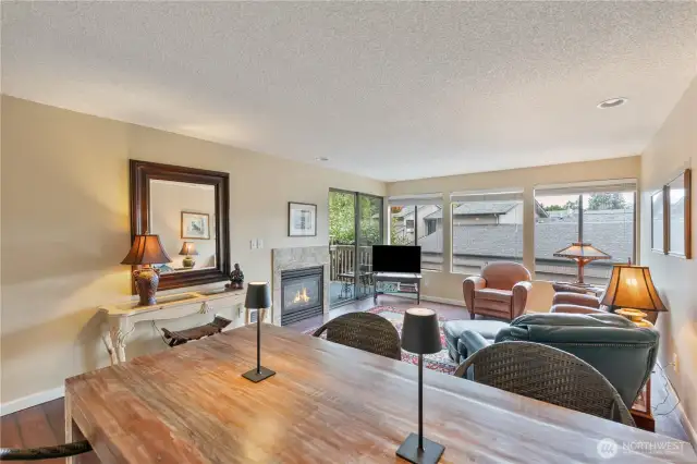 Good sized living room with a gas fireplace and a small deck off the front of this townhouse.