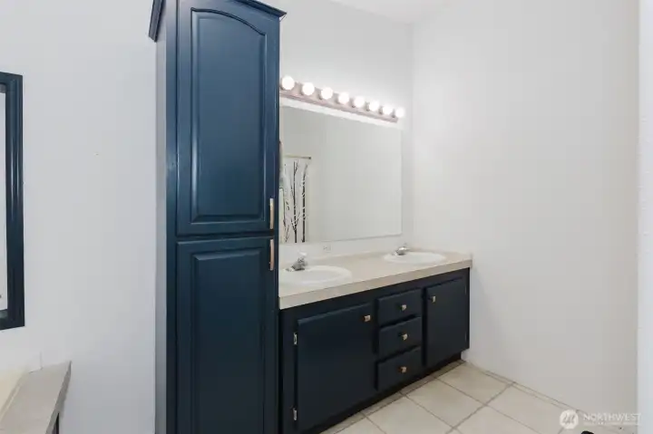 Primary Bath has double sinks and separate shower