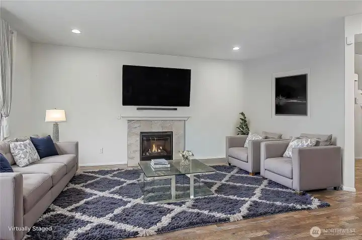 Down the hall, in the rear of the main floor you will find open-concept living with your family room and kitchen. Large family room with gas fireplace for cooler nights. ***Virtually Staged***