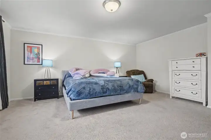 Upstairs Primary Suite, generous in size and I love the crown molding!