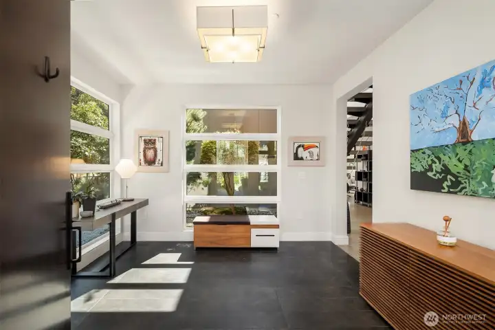 Light-filled entry with a gallery-like feel—framing views of the landscape and introducing the home’s architectural language.