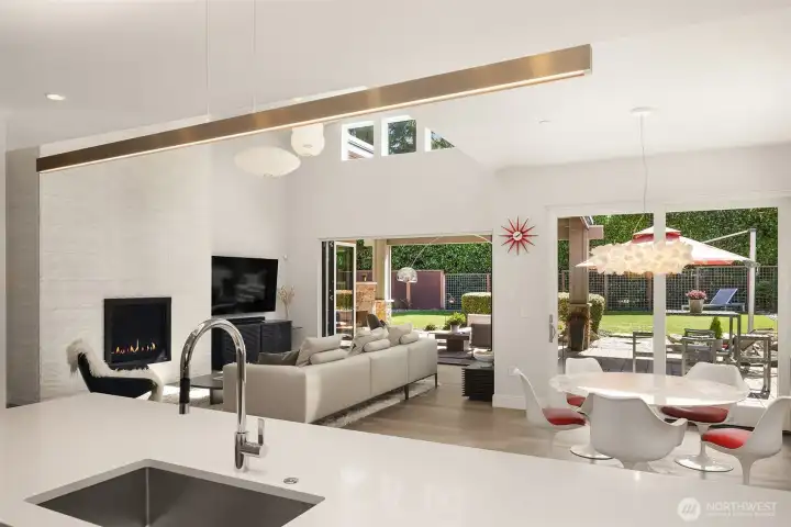 Kitchen positioned to engage the entire home—seamless sightlines to living, dining, and outdoor spaces.