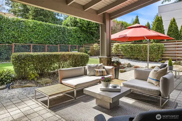 Designed for everyday living and effortless entertaining—covered outdoor spaces with built-in grilling, dining, and lounge areas, all anchored by a private, landscaped yard with turf