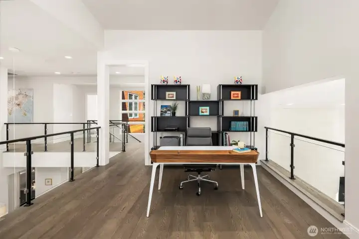 Open loft workspace overlooking the main living area—bright, connected, and highly functional.
