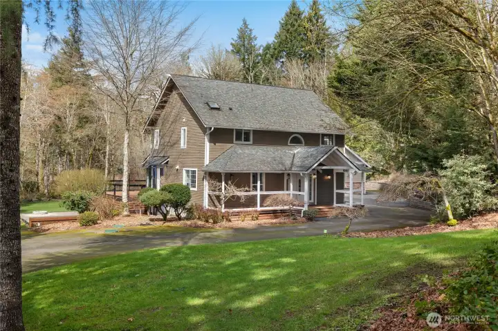 Surrounded by nature, this property offers a peaceful setting and welcoming first impression.