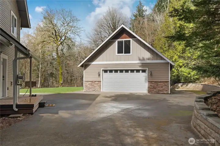 Newer detached shop offers room for 3 cars plus excellent workspace or storage.