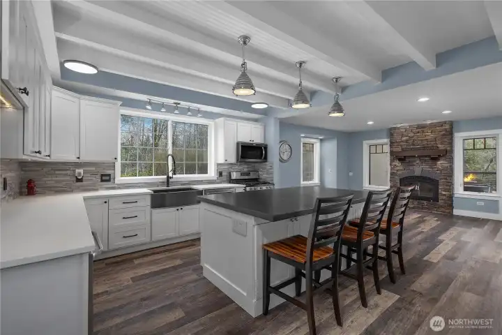 Thoughtfully designed kitchen offers abundant cabinetry, prep space, and casual dining.