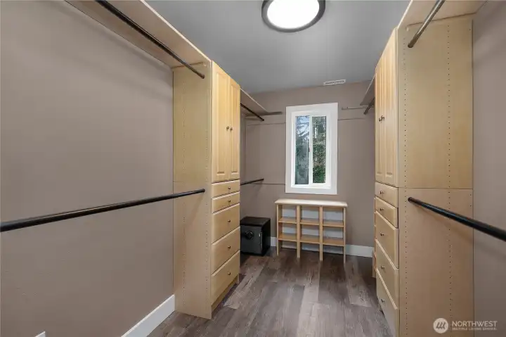 Spacious closet includes custom-style storage for a clean and efficient layout.