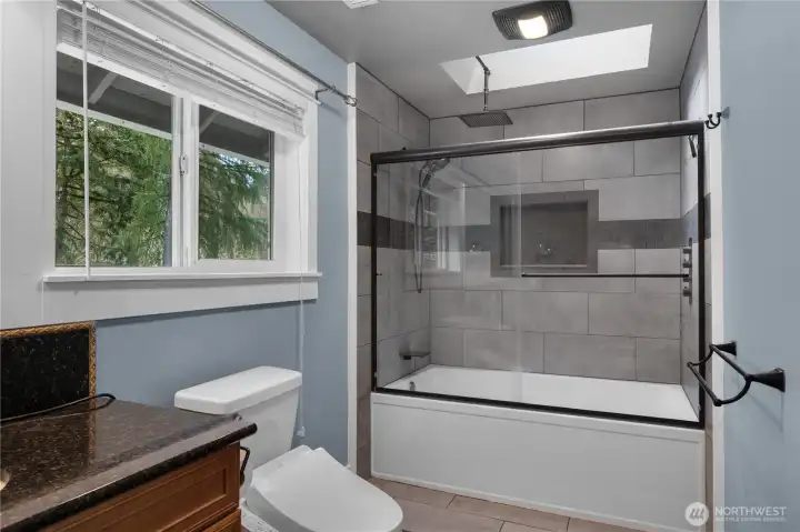 Stylish bath detail highlights the upgraded tile work and clean contemporary design.