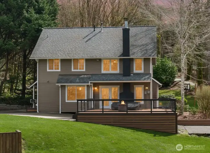 Enjoy indoor-outdoor living with a large deck overlooking the peaceful open lawn.