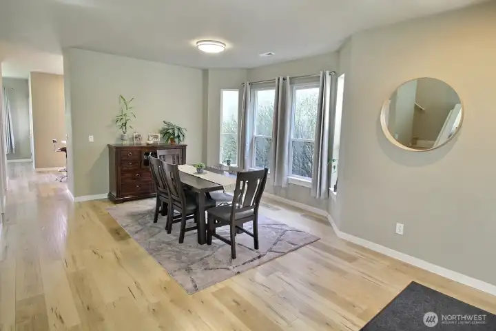 Dining room with a  bay window wall, and plenty of space for table for 8 to 10 people.