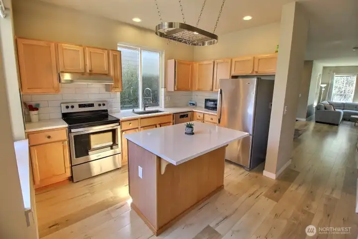 Efficient kitchen with breakfast bar island, a great workstation for helpers!