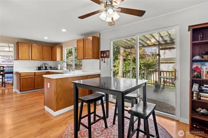 Kitchen eating area with slider to the covered patio.