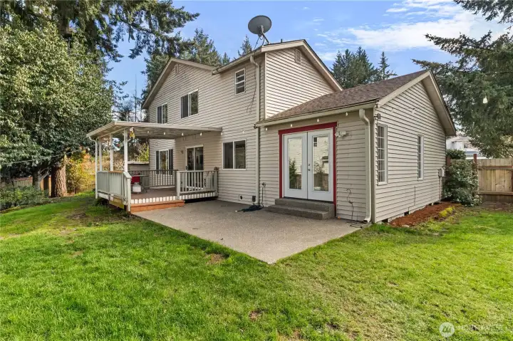 Appreciate the covered deck and the patio off the Dining Room.  All fenced.