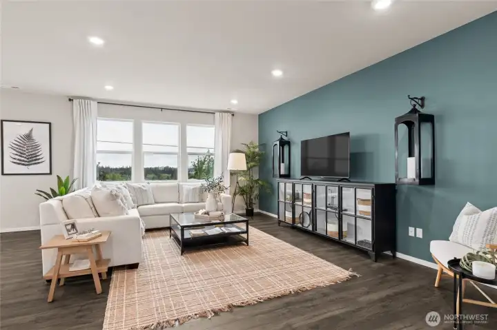 Large family room with picturesque windows. Photos are for representational purposes only.  Colors and finishes may vary.