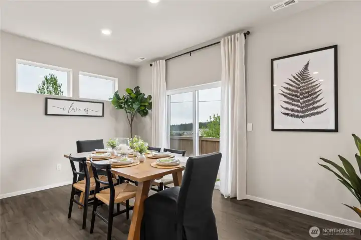 Convenient dining room next to the kitchen and island.  Photos are for representational purposes only.  Colors and finishes may vary.