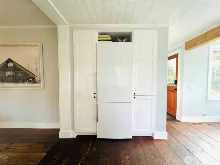 The open floor plan extends into the kitchen.