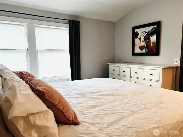 Upstairs primary bedroom with wool wall to wall carpet.