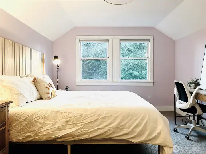 Bedroom 2 is large and light. The original windows add to the charm.