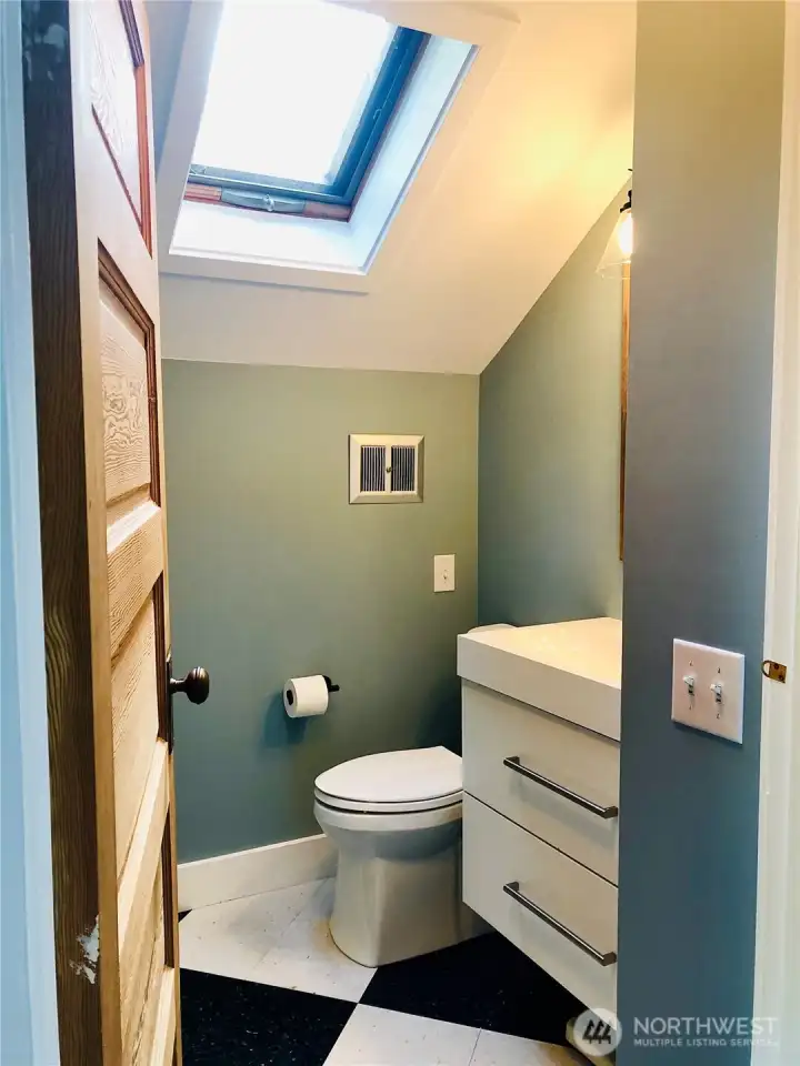 A powder room is conveniently located within the primary. Consider taking park of the closet to add a shower here?