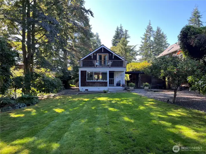 The rear elevation with plenty of grass to host a game of croquet or to kick a soccer ball!
