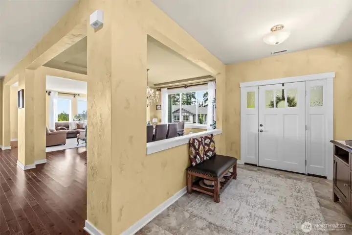Step inside to an inviting foyer leading to an open-concept main level.