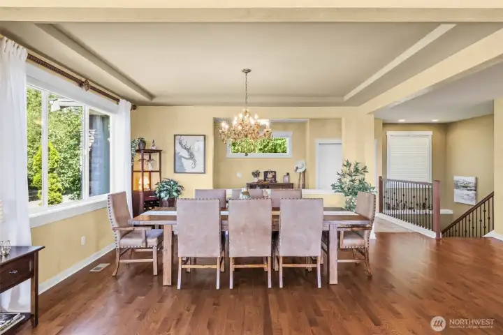 The formal dining area offers a beautiful and open large table space with room for your serving buffet.