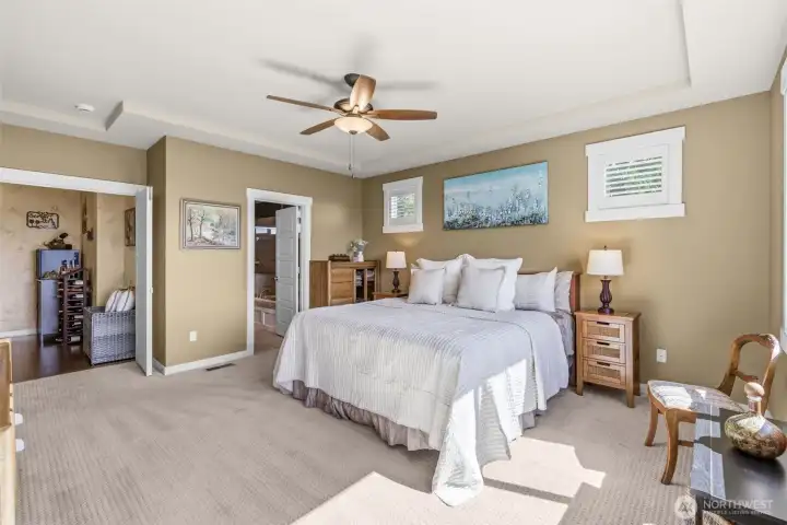 Double doors to spacious main floor primary suite offering convenience and privacy.