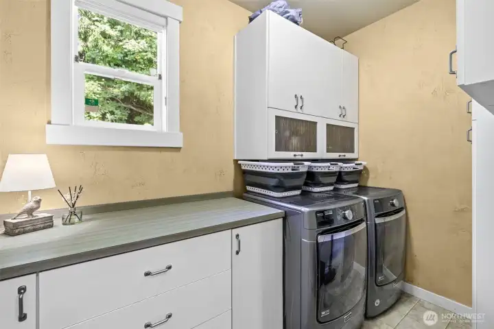Upper level laundry room with window. Tankless hot water, and home is equipped with air conditioning.