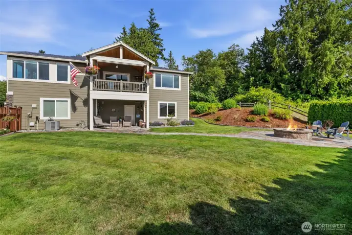 Flagstone patio out lower-level door is a great location for watching movies outdoors.