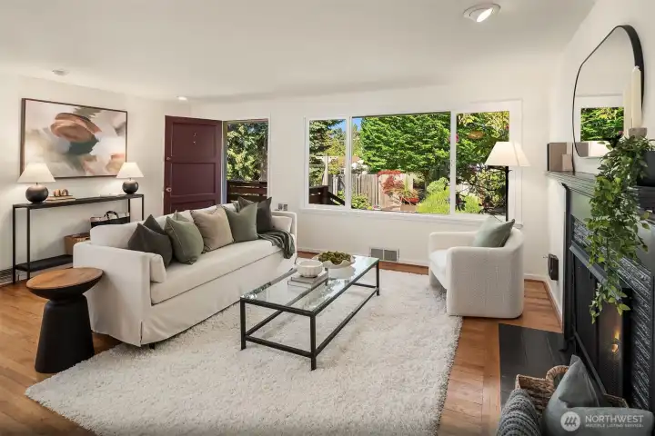 The oversized picture window frames the lush front gardens like living artwork while filling the home with natural light throughout the day.