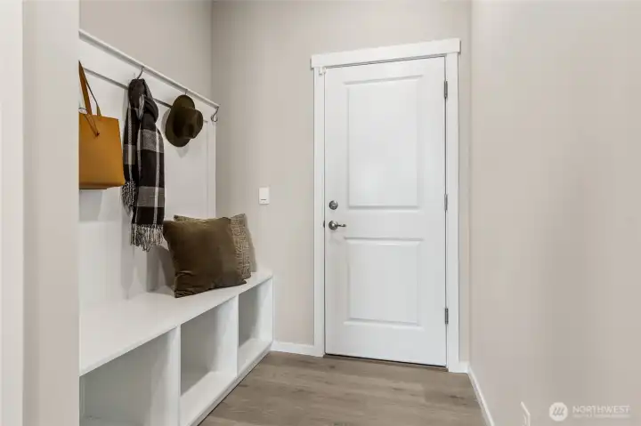 Drop Zone coming in from the garage.  Huge walk in pantry located in the room adjacent.  Finishes and colors may vary.