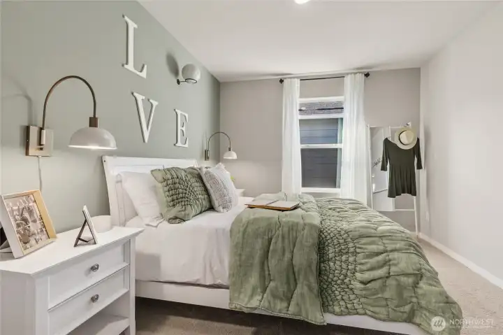 1 of 2 hall bedrooms with walk-in closet.  Finishes and colors may vary.