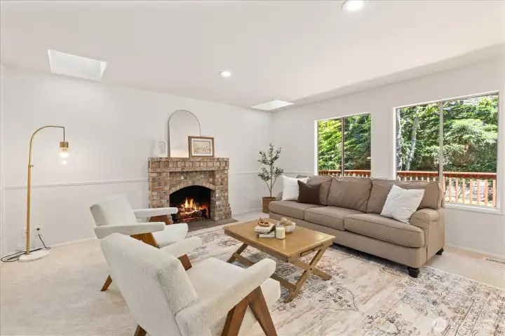 Living Room w/ Skylights and Cozy Gas Fireplace