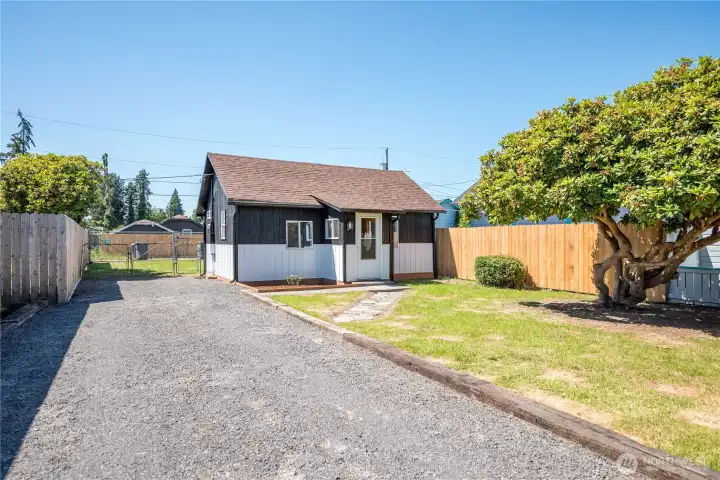 Fully fenced yard, with 2 gates to access alley. Room to build a garage.