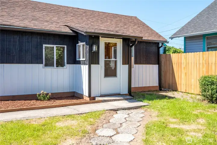 Exterior featuring newly painted metal and wood siding.