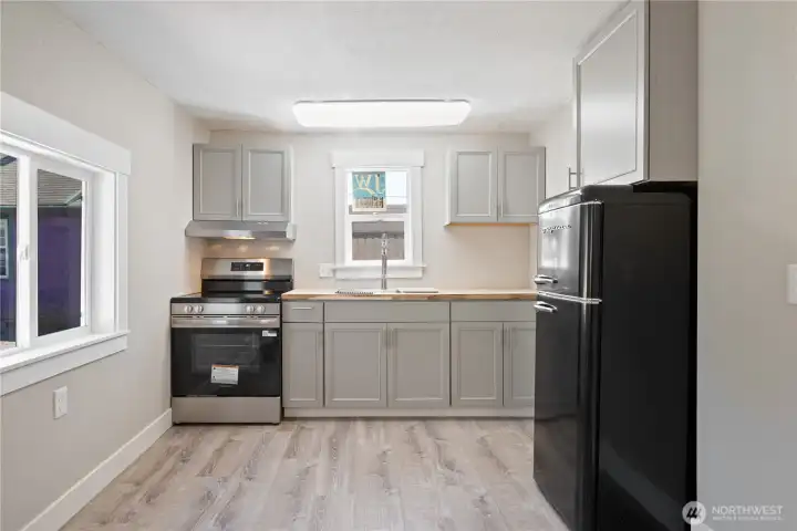 Brand new kitchen and appliances. room for table.