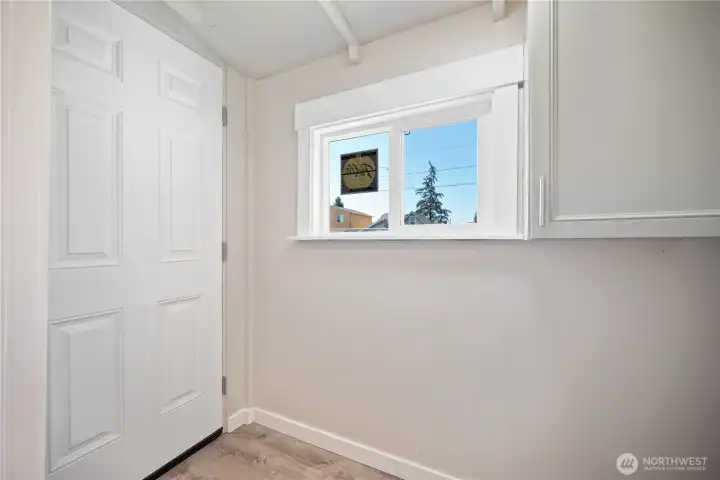 Extra room with storage leading to back yard.