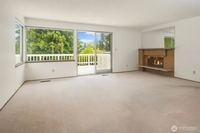 Expansive windows bring in abundant natural light, while offering easy access to the deck and backyard.