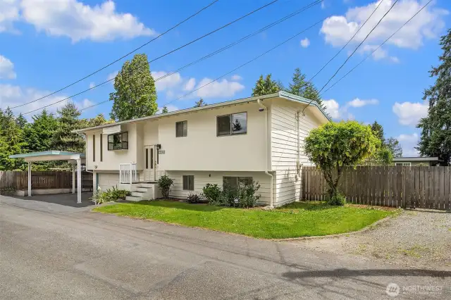 This home offers extensive parking options, including a two-car garage, a carport, and ample space for an RV, boat-all your toys!