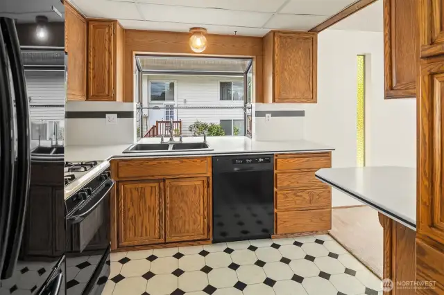 This fabulous kitchen shines with tons of counter space, great storage, and a gas stovetop.
