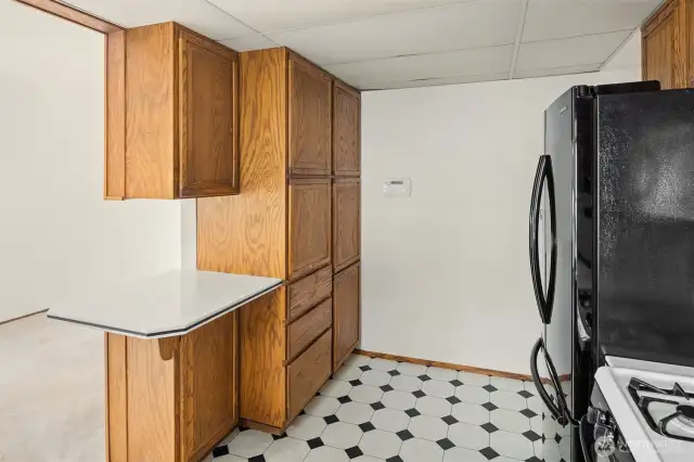 Looking to expand? The kitchen can easily be opened up to the adjoining dining room, creating a more spacious and seamless layout.