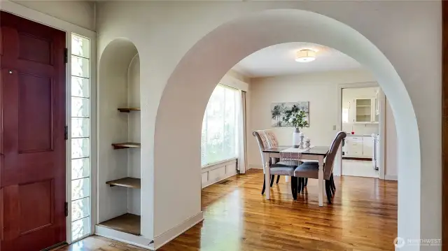 View From Entryway To Dining Room W/ Built-In Shelving And 2 Closets