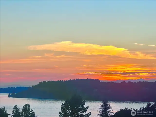 Brilliant sunsets over Puget Sound with Olympic Mountains in the background.