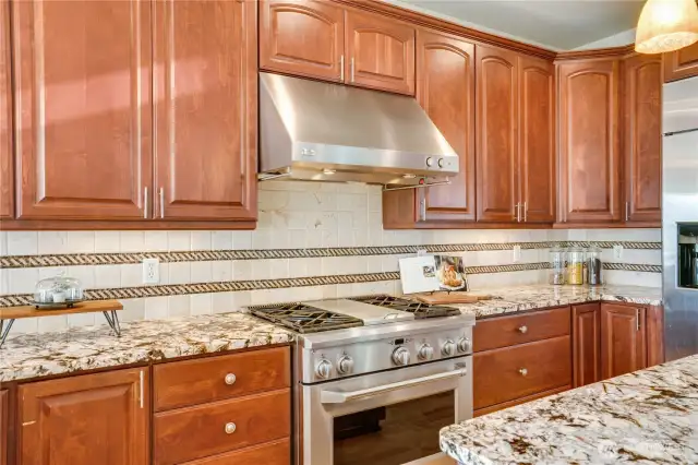 Gas stove with center cooking section.