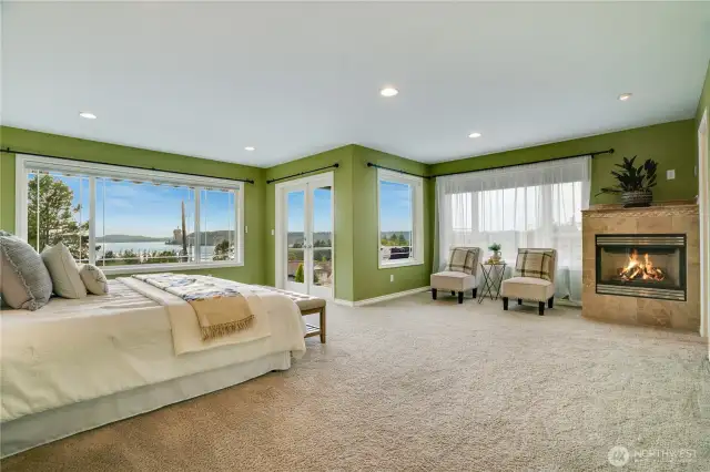Amazing views in the primary suite!  Generous size easily fits king sized beds, seating &  fireplace for mood setting.  Private deck for a toast.  The escape from it all without leaving home.