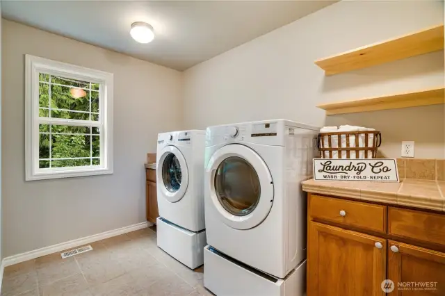 Large laundry room with folding counter & storage is right off the primary & bedrooms 2-4 for ease.
