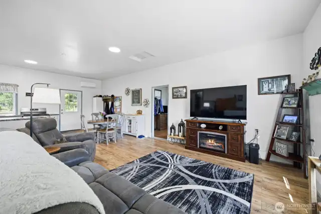 Spacious and sunny with a door leading onto the backyard.